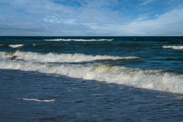 View of the incoming wave on the Baltic Sea on the shore of the Curonian Spit on a summer day, Kaliningrad region, Russia