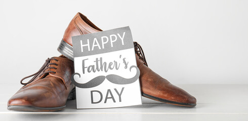 Greeting card for Happy Father's Day with male shoes
