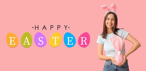 Pretty young woman with bunny ears and gift on pink background. Easter banner