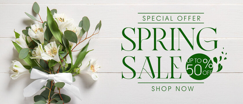 Beautiful bouquet of alstroemeria flowers and eucalyptus branches on white wooden background. Spring Sale