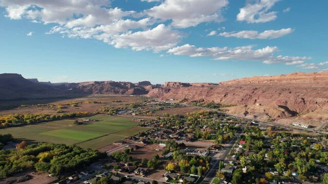Panning to the left drone shot of the north end of moab city, utah on a nice day
