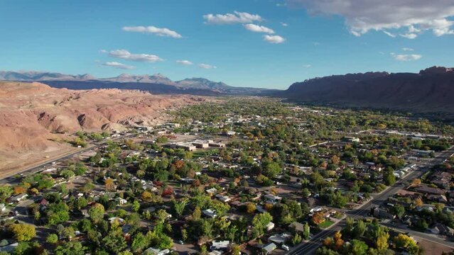 Panning to the right drone shot of moab, utah on a sunny day
