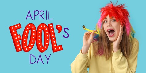 Banner for April Fools' Day with funny young woman wearing wig on light blue background