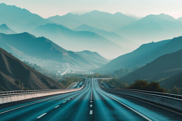 The wide blue highway in front of mountains.