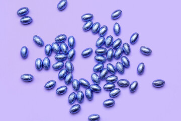 Chocolate Easter eggs on lilac background
