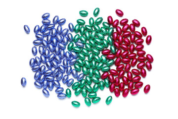 Chocolate Easter eggs wrapped in color foil on white background