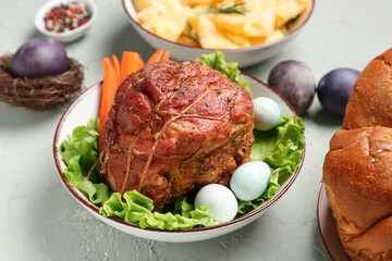 Plate with tasty ham for Easter dinner on grunge background