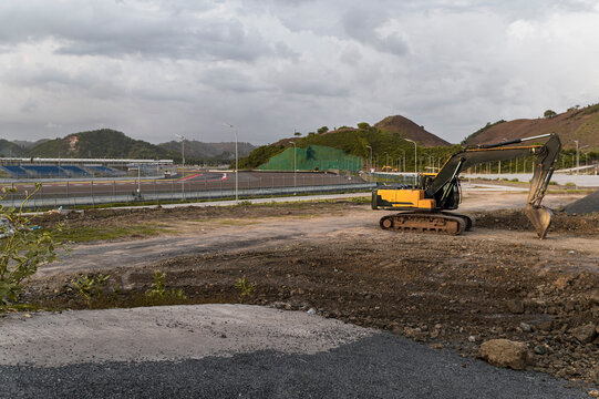 Development in progress, excavator on a construction site