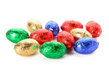 Chocolate Easter eggs in colorful foil isolated on white background