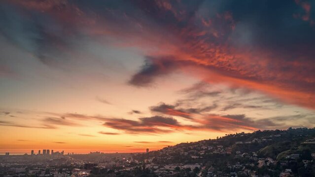 Red sunset over the city of Los Angeles cityscape. Aerial hyperlapse timelapse.