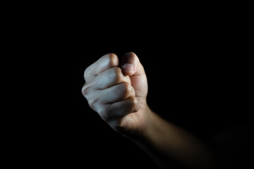 fist, Hand gesture. man clenched fist, ready to punch, isolated on black, close-up, copy space - obrazy, fototapety, plakaty