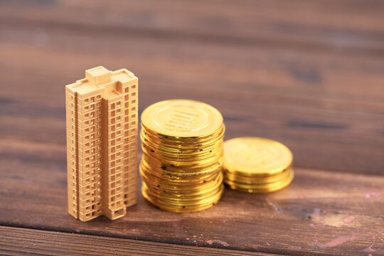 Models of buildings and gold coins
