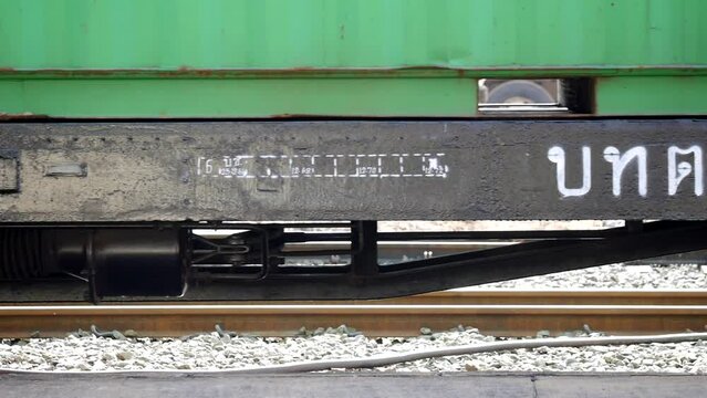 train leave railroad station on rails, train leaving a railway station, Rail system. Industrial concept background, Railroad travel, railway tourism or cargo transportation, Thai train, train wheels