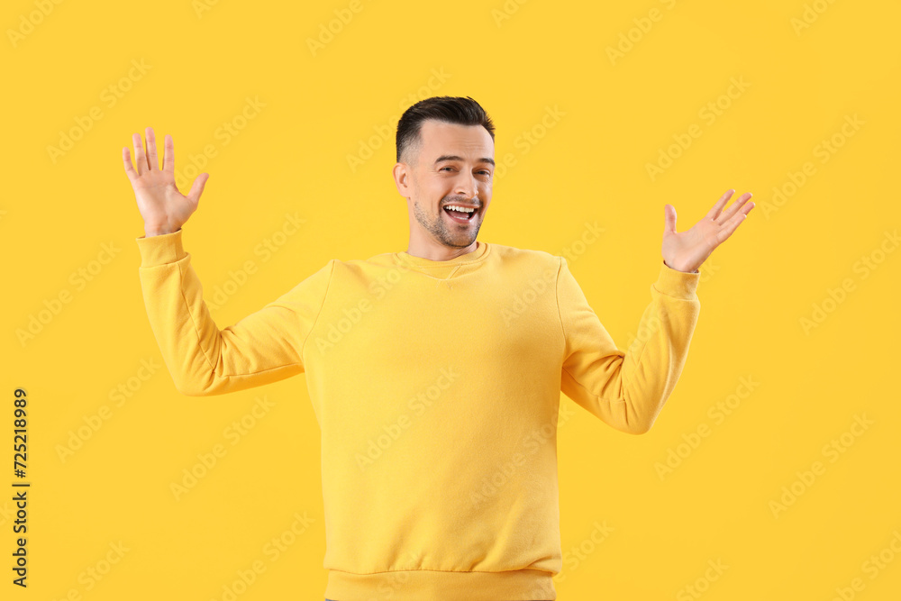 Canvas Prints Happy young man on yellow background