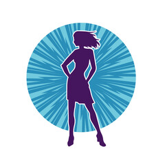 Silhouette of a female dancer wearing mini skirt in action pose. Silhouette of a slim woman dancing happily.