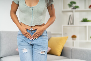 Woman touching her belly feeling menstruation pain - obrazy, fototapety, plakaty