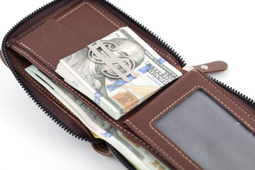 Wallets and dollar bills on white background