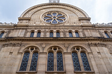 Fototapeta na wymiar facade of orthodox jewish synagogue built in roman byzantine architectural style in paris france