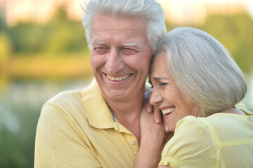 Fototapeta premium Portrait of beautiful elderly couple together in park