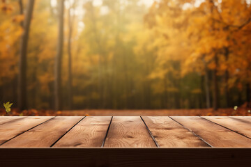 Empty wooden table over blurred autumn forest background, product display montage