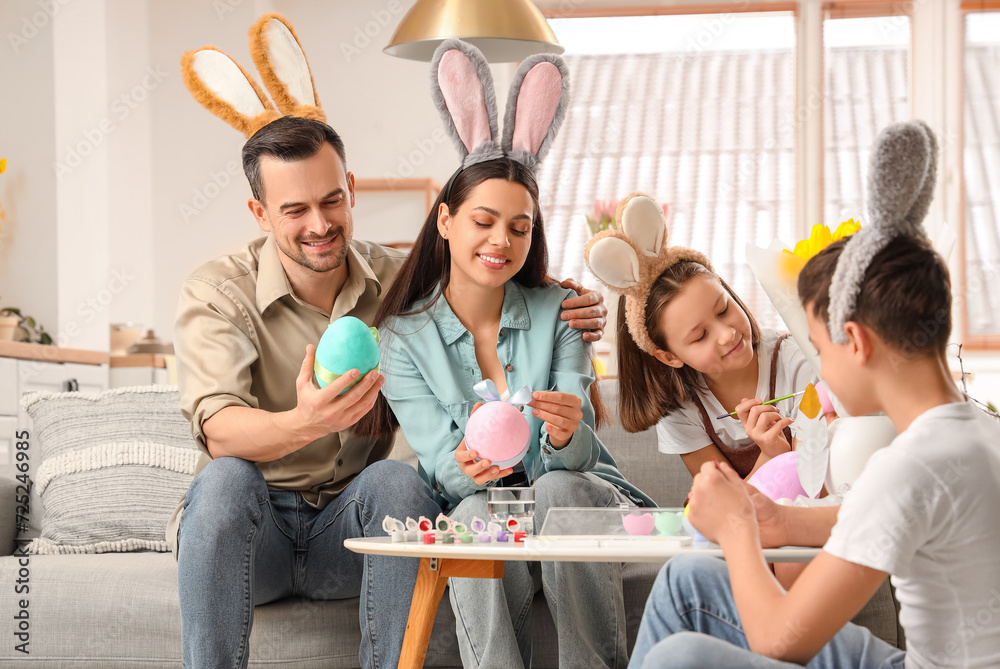 Canvas Prints happy family painting eggs at home on easter day