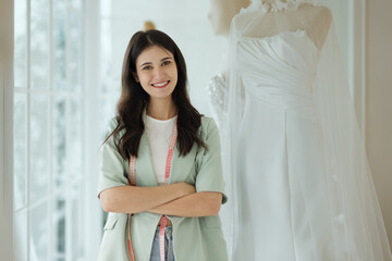 Portrait of entrepreneur bridal shop owner business woman fashion designer stylish working.