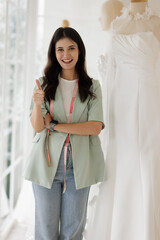 Portrait of entrepreneur bridal shop owner business woman fashion designer stylish working.