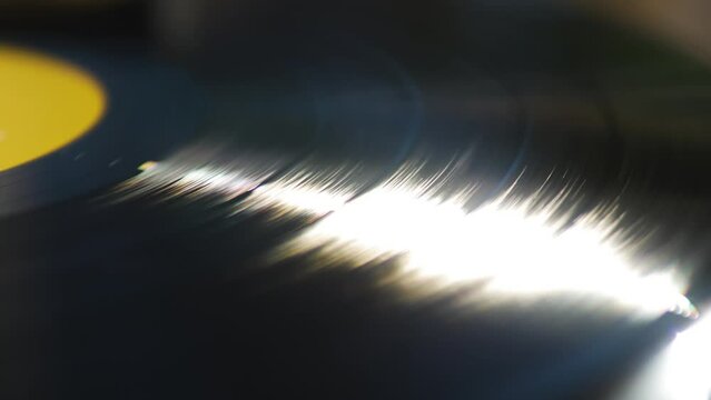 Close Up of a Spinning Vinyl Sun Reflection