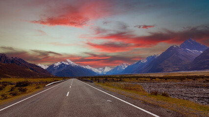 Sunset view with  mountain range near Aoraki Mount Cook and the road leading to Mount Cook Village in New zealand