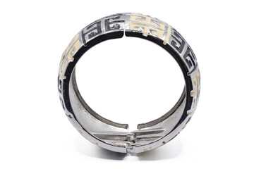 old bangle bracelet made from shiny metal  isolated on  white background,macro photo,has path