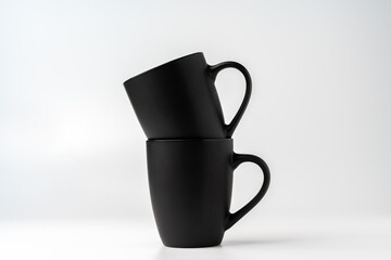 Black coffee mugs mock up on white background copy space