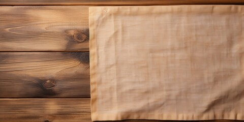 Wooden background with space for text, showcasing kitchen cloth.