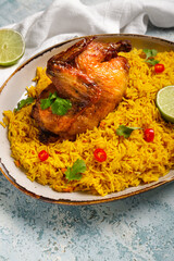 Plate of traditional chicken biryani on blue background