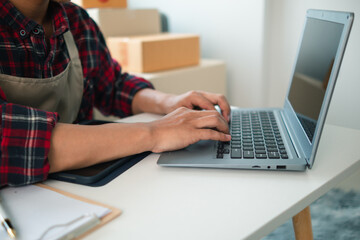 small SME entrepreneur has opened Home Office receive product orders and is checking product orders from online platforms order  deliver products according to orders.Home Office for business startups