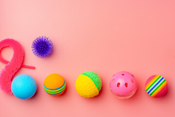 Fototapeta na wymiar Pet toys on pink background studio shot