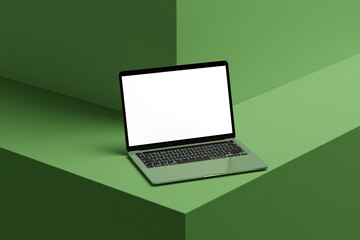 laptop mockup with white screen and green wall background