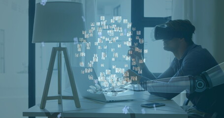 Image of globe of connections over robot's arm and man wearing vr headset in background