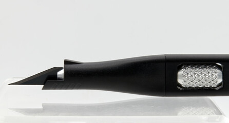 Black cutter isolated on white background. Close-up.