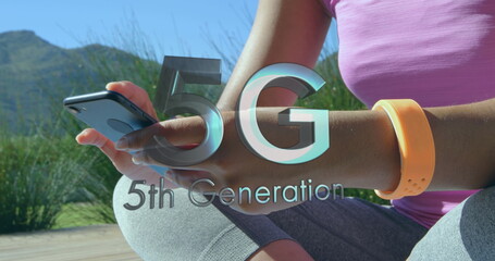 Image of 5g 5th generation text with globe spinning over woman using smartphone