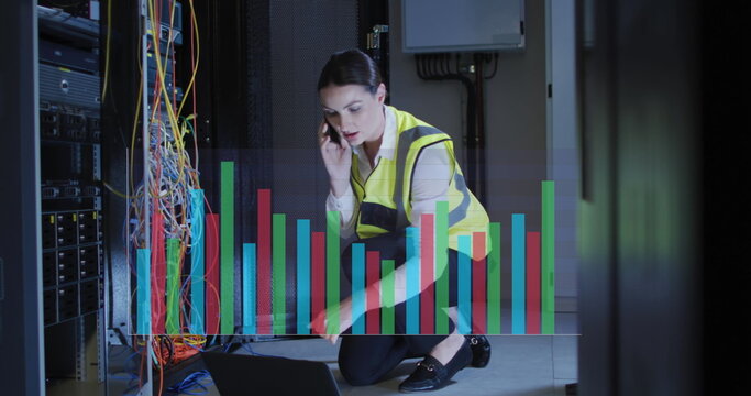 Image of graphs over caucasisn woman working in server room
