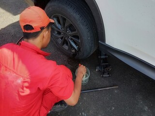 officers checking the condition of car tires.