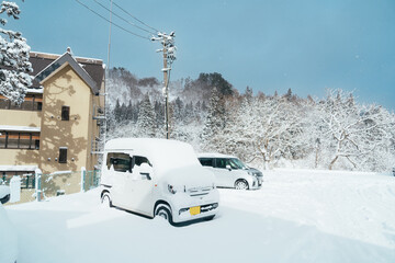 Car park at Ginzan Onsen with snow fall in winter season is most famous Japanese Hot Spring in...