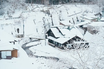 Beautiful view of Ginzan Onsen village with snow fall in winter season is most famous Japanese Hot Spring in Yamagata, Japan.