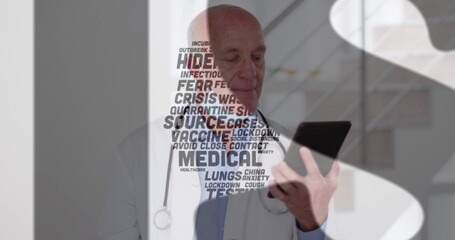 Obraz premium Covid-19 concept texts against caucasian male doctor with lowered face mask using digital tablet