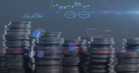 Image of financial data processing over stack of coins