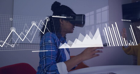 Image of data processing over biracial businesswoman using vr headset