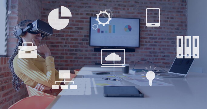 Image of data processing over biracial businesswoman using vr headset - Powered by Adobe