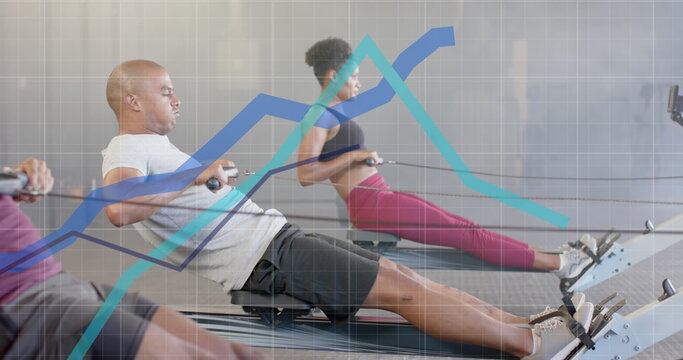 Image of graph processing data over diverse men and woman training on rowing machines at gym