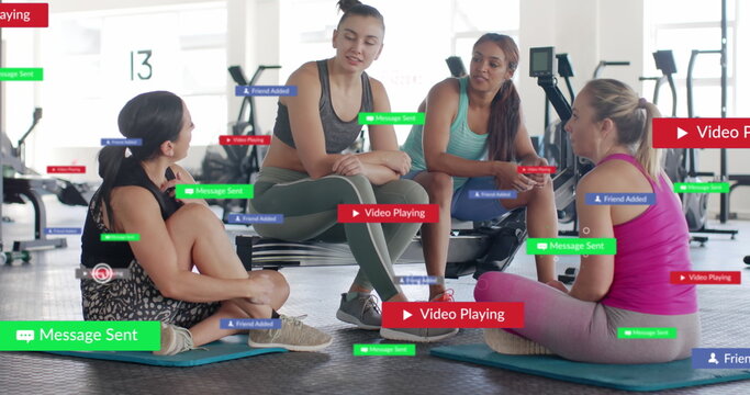 Image of social media notifications over caucasian women talking at gym