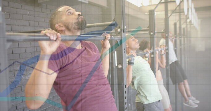 Fototapeta Image of graph processing data over diverse group on pull up bars cross training at gym